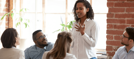 young woman speaking to group