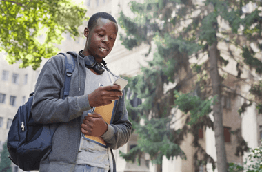 college student looking at phone